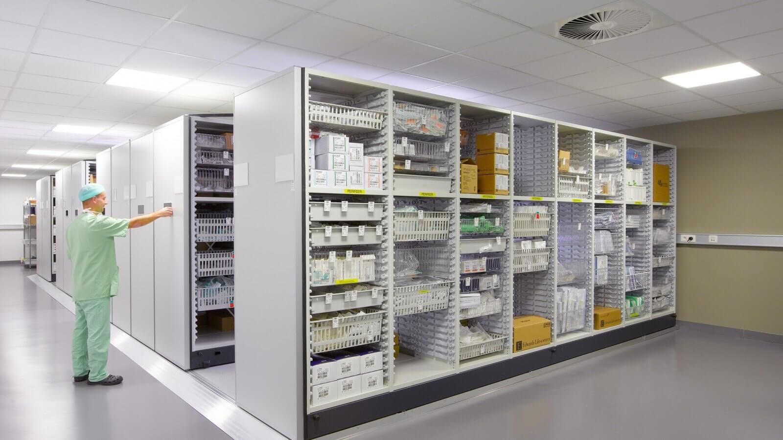 healthcare medical supplies storage room featuring mobile shelving units